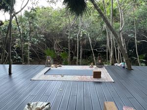 Yoga on the mangrove platform  at The House of AïA in Playa Del Carmen