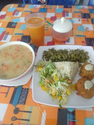 Veggie soup. Green beans, tropical salad, rice, soy meatballs. at Gira El Sol in Pasto
