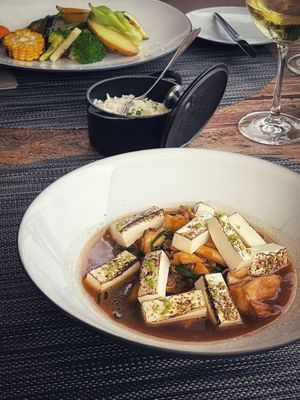 Tofu with vegetable jus - shitake, daikon, shimeji
 and burger with curry at Avista Restaurant in Funchal