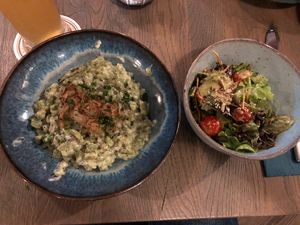 Spinatspätzle served with salad   at Emmi's Kitchen in Augsburg