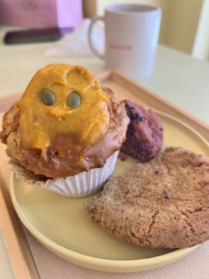 Pumpkin muffin and partially eaten caramel tea cookie and purple sweet potato scokie  at Ovgo B.A.K.E.R Edo St in Tokyo