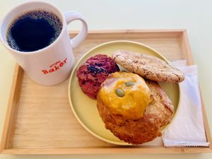 A pumpkin muffin, a caramel tea cookie, and a purple sweet potato scokie and a black coffee  at Ovgo B.A.K.E.R Edo St in Tokyo