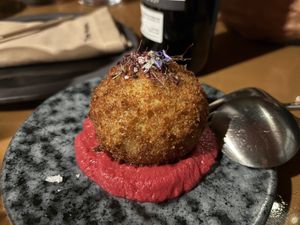 Starter - vegan bomb - a ball filled with beyond meet, on beetroot hummus. Amazing! To small to share for 4 people.  at Three House Hotel & Gastrobar in Funchal