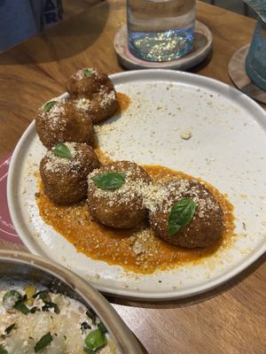 Bland arancini with a delicious sauce  at NIYA in Casablanca