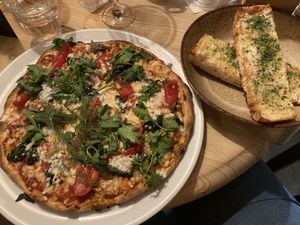 Vegan pizza and garlic bread at Rumour in Totnes