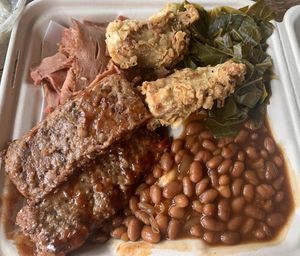 “Ribs”, “pulled pork,” “chicken tender” bbq plate with baked beans and collard greens  at Your Local Seitanist in Chattanooga