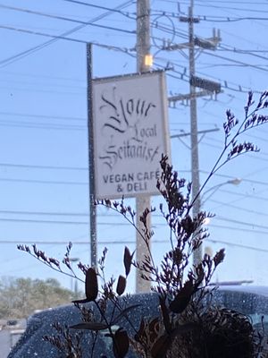 Unobtrusive sign, watch for turn carefully  at Your Local Seitanist in Chattanooga