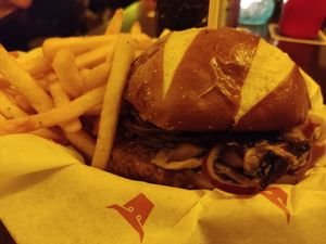 Magic mushroom truffle and Swiss vegan burger with fries at The Tavern in Prague