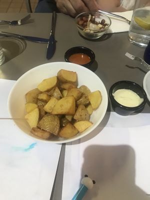 Patatas con brava y alioli. at Americano Vegano in Torremolinos