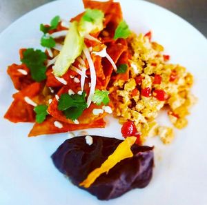 Chilaquiles con tofu revuelto y frijoles refritos at Americano Vegano in Torremolinos