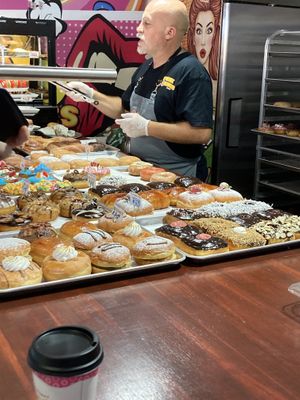 The two trays in the back are all vegan! Very kind and knowledgeable staff.  at Pink Donuts and More in Oakland Park