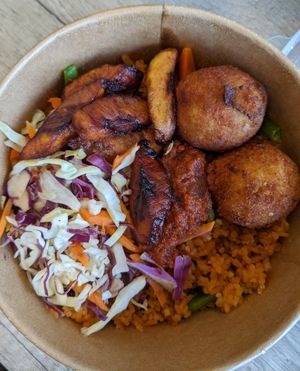 Jollof rice with plantain and yam balls at Veghana in Dubai