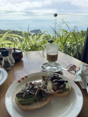 Asked for bagel with avocado and mushrooms. Almond latte. Delicious!  at Emilio's Cafe in Aguirre