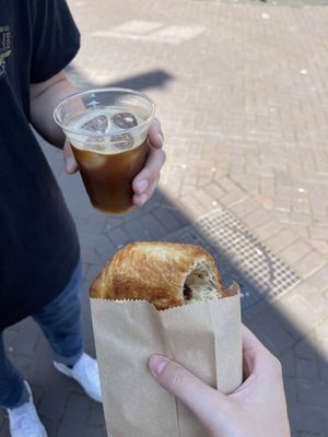 An iced black coffee and pain au chocolat  at Margo's Amsterdam - Jordaan in Amsterdam