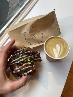 Pistachio rose danish / oat flat white   at Margo's Amsterdam - Jordaan in Amsterdam