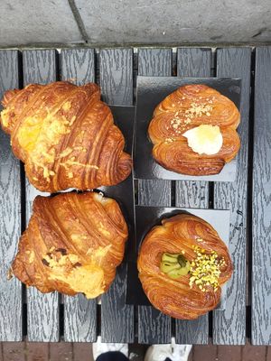 croissants with cheese and ham and cheese, key lime and pistachio brioches at Margo's Amsterdam - Jordaan in Amsterdam