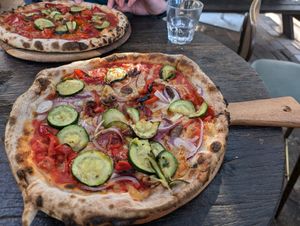 Vegan pizzas with vegan cheese at Treehouse On Belongil in Byron Bay