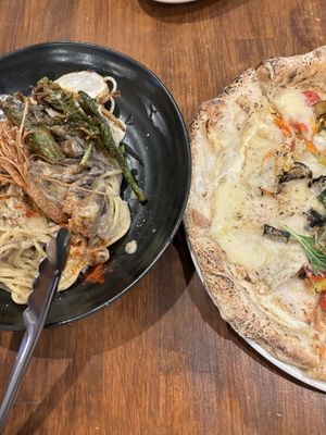   at Unique (V) Pizzeria SUKHASANA in Osaka