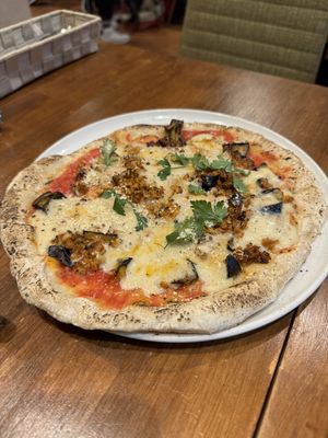   at Unique (V) Pizzeria SUKHASANA in Osaka