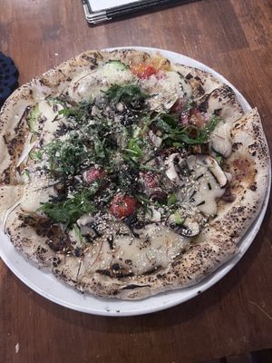   at Unique (V) Pizzeria SUKHASANA in Osaka