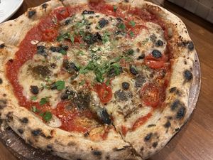   at Unique (V) Pizzeria SUKHASANA in Osaka