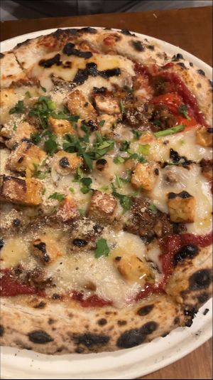   at Unique (V) Pizzeria SUKHASANA in Osaka