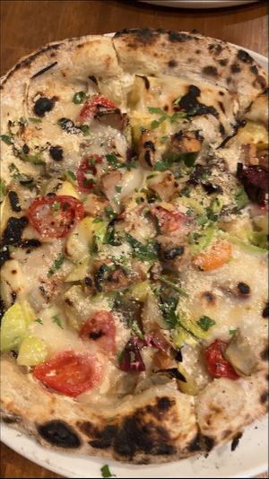   at Unique (V) Pizzeria SUKHASANA in Osaka