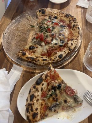   at Unique (V) Pizzeria SUKHASANA in Osaka
