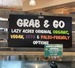 grab and go sign (includes sandwiches, pizzas, salads, hot bar, bakery, and some prepackaged meals)  #Veganuary at Lazy Acres Natural Market in San Diego