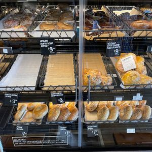 vegan donuts & some vegan bagels (orange sticker means vegan)   at Lazy Acres Natural Market in San Diego