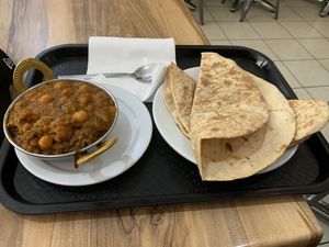 Medium sized eggplant curry and chickpea curry with vegan rotis. Hit the spot.   at City Indian Cuisine in Adelaide
