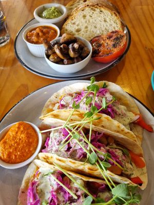 Chickpea tacos with cabbage & mayo (front),  build-a-brekky at the back with toast,  pea avo smash, beans, balsamic shrooms &  tomatoes at Chalkys Espresso Bar in Fremantle