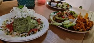 Avocado  something pasta and naked burger at Vegan Oasis in Tallinn