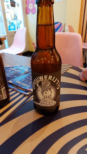 A drink with a fliwer burger. at Flower Burger in Amsterdam