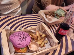 Smoky Butterfly burger (left), Flower Bombs (top middle) and Jungle BBQ burger (top right) at Flower Burger in Amsterdam