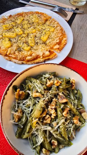Pizza vermuteria and vegan pasta pesto at La Vermuteria in Solsona