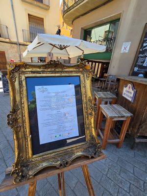 Menu in nice frame on street at La Vermuteria in Solsona