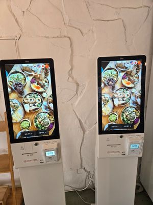 Two kiosks right when you walk in at Plant Cafe & Kitchen - Yeonnam in Seoul