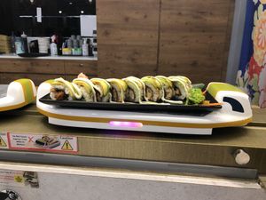 Food comes on an express train  at Saute Sushi 素特•素司 in Central Singapore