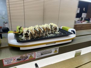 Sushi delivered via a conveyor train   at Saute Sushi 素特•素司 in Central Singapore