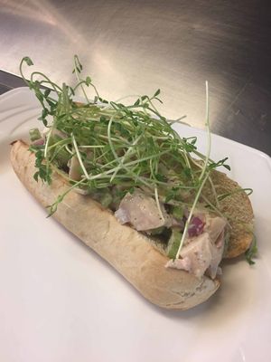 Lobster-ish Roll- palm hearts, vegan old bay mayo, pickles, shallots, celery, pea shoots on a vegan hoagie. Available GF.  at Whitetooth Mountain Bistro  in Golden