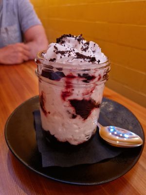 Gf brownie with coconut whip and cherries at Whitetooth Mountain Bistro  in Golden