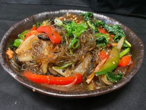 Famous Korean Vegan Jabche - Glass Noddles with winter shitaki mushroom mixed veg with sweet soy sauce, finishing with Sesame oil at Korean BBQ House- Barbican in London