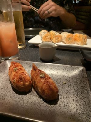 Shitaki bacon inari and baked crab roll. Both were so good!  at PLANTA Queen in New York City