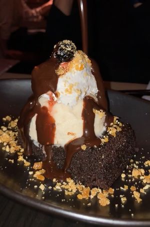 brownie with ice cream and chocolate sauce - amazing!!! at PLANTA Queen in New York City
