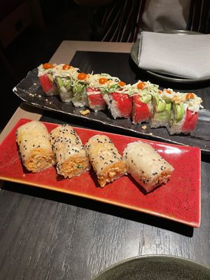 Rainbow Roll (back) Baked Crab Roll (front)  at PLANTA Queen in New York City