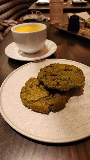 Golden latte and matcha chocolate chip cookies at PLANTA Queen in New York City