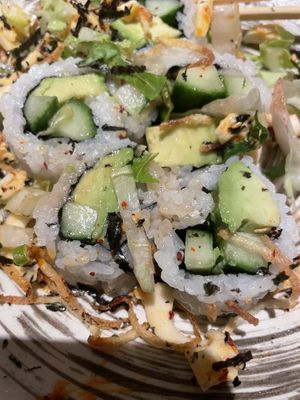 Under the volcano topping were these sushi rolls    at PLANTA Queen in New York City