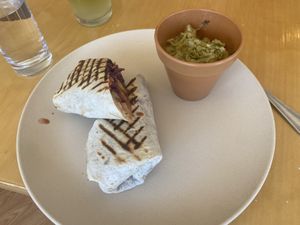 Tempeh wrap: 4/5! Medium spicy, so baby mouths don’t order. I thought it was good but just really acidic. The side jerk cabbage slaw was 2/5. Really not my taste  at Trillium Farm to Table in Laconia