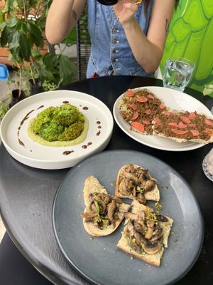 Pesto mushrooms on sourdough, fave with roasted broccoli and mole lentil tostadas   at Etnofood in Oaxaca